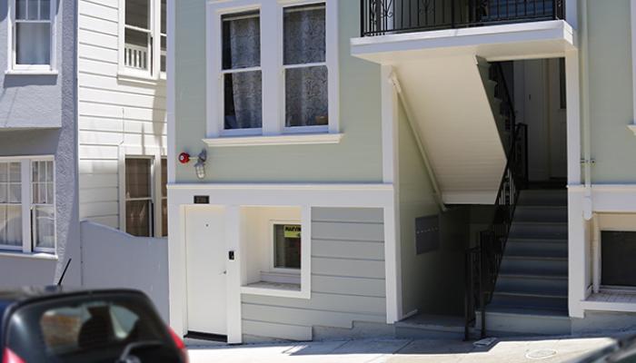 street view of apartment building showing additional unit added to basement level